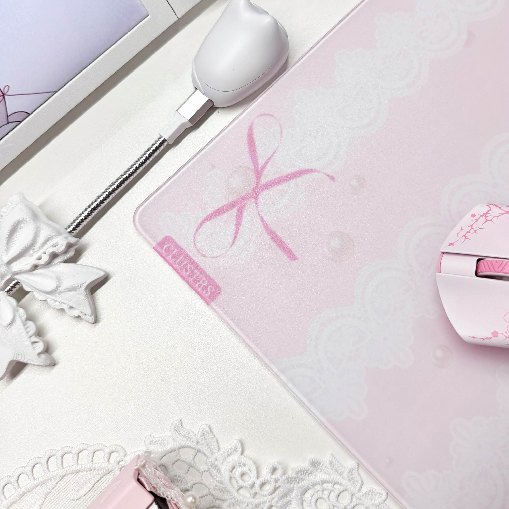 Close-up of the Bunny glass mousepad with pink bows, lace details, and rounded edges.