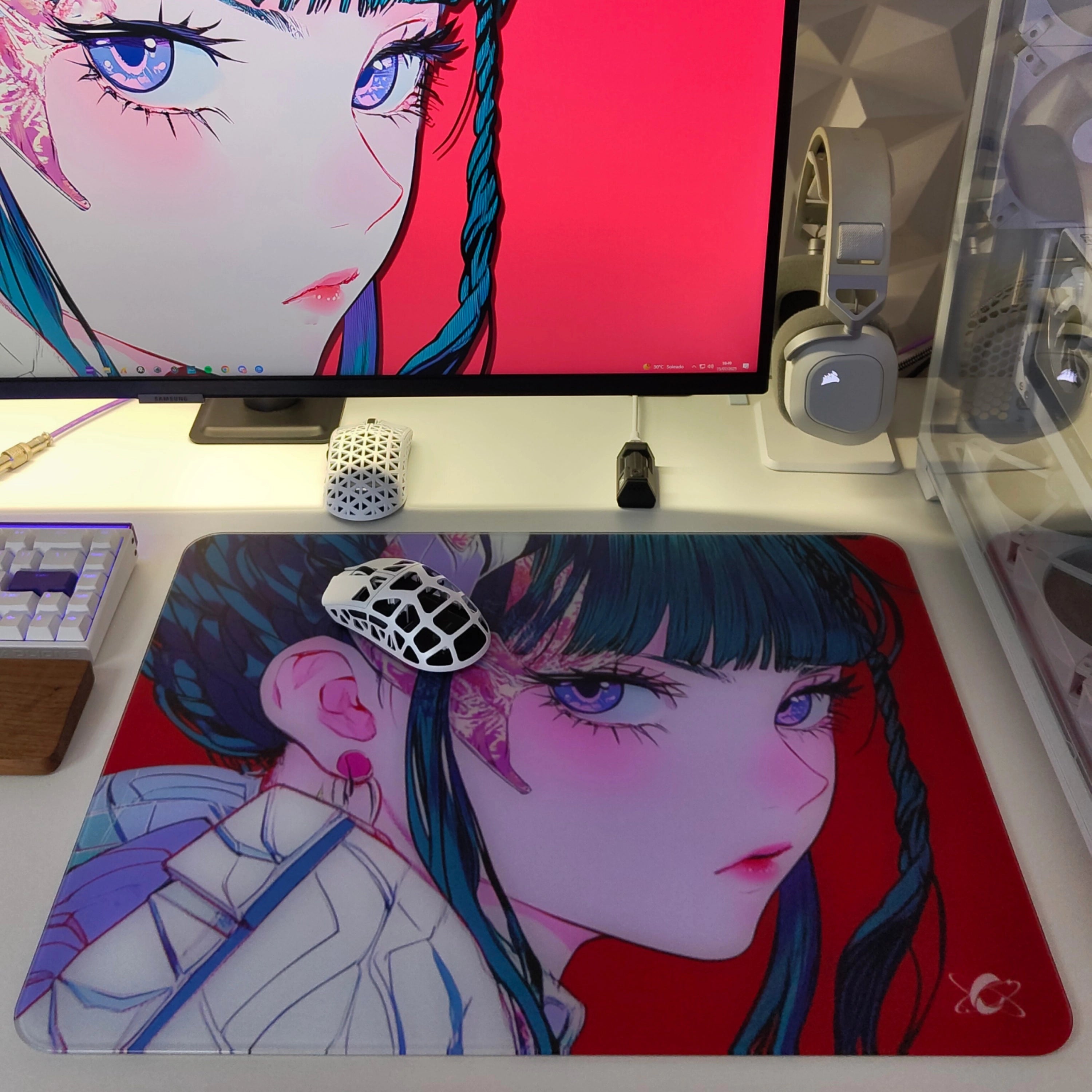Clustrs Akira glass mouse pad on a clean desk setup with a white gaming mouse and matching Akira wallpaper on the monitor.