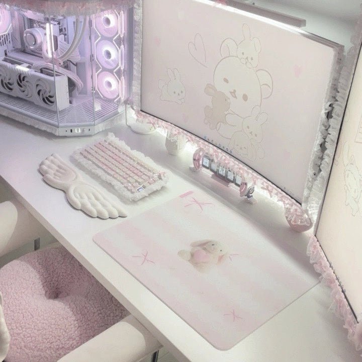 Clustrs Pearl Bunny glass mousepad on a soft pink kawaii gaming setup with white keyboard, wing wrist rest, and pastel accessories.