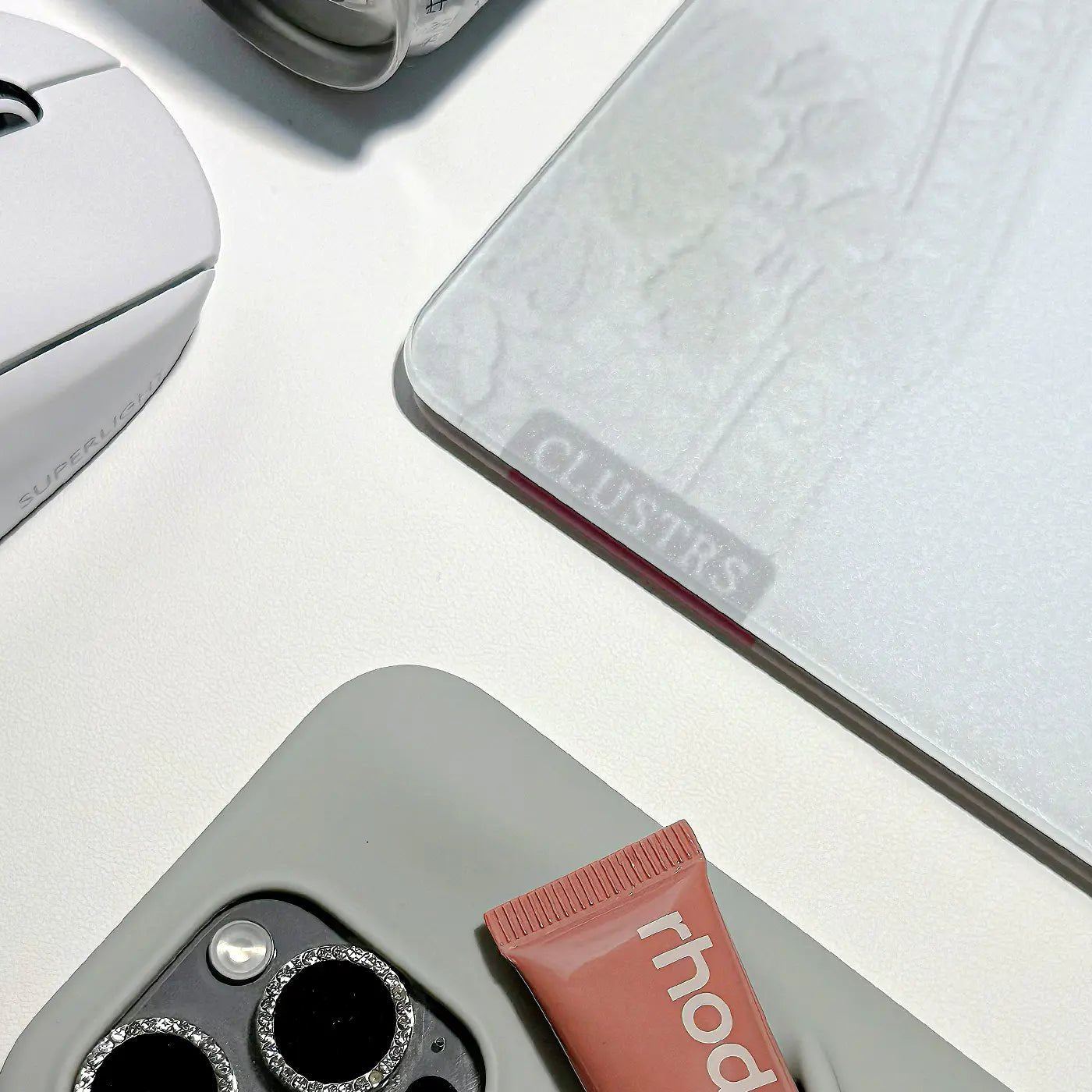 Clustrs White Lacey glass mousepad on a minimalist desk setup