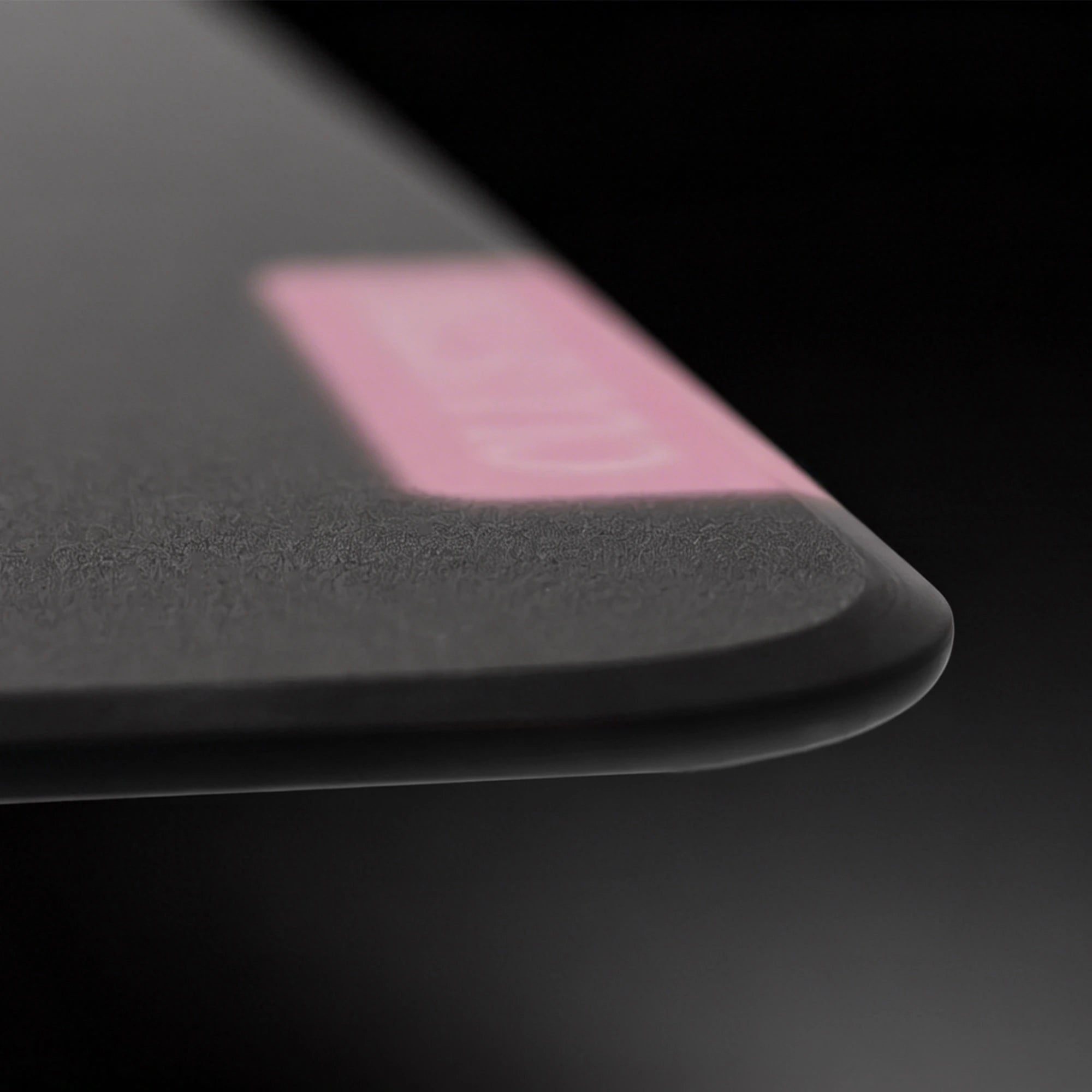 Close-up of the 2.5D CNC edge on the Lilies glass mouse pad, designed for a smoother and more comfortable feel.