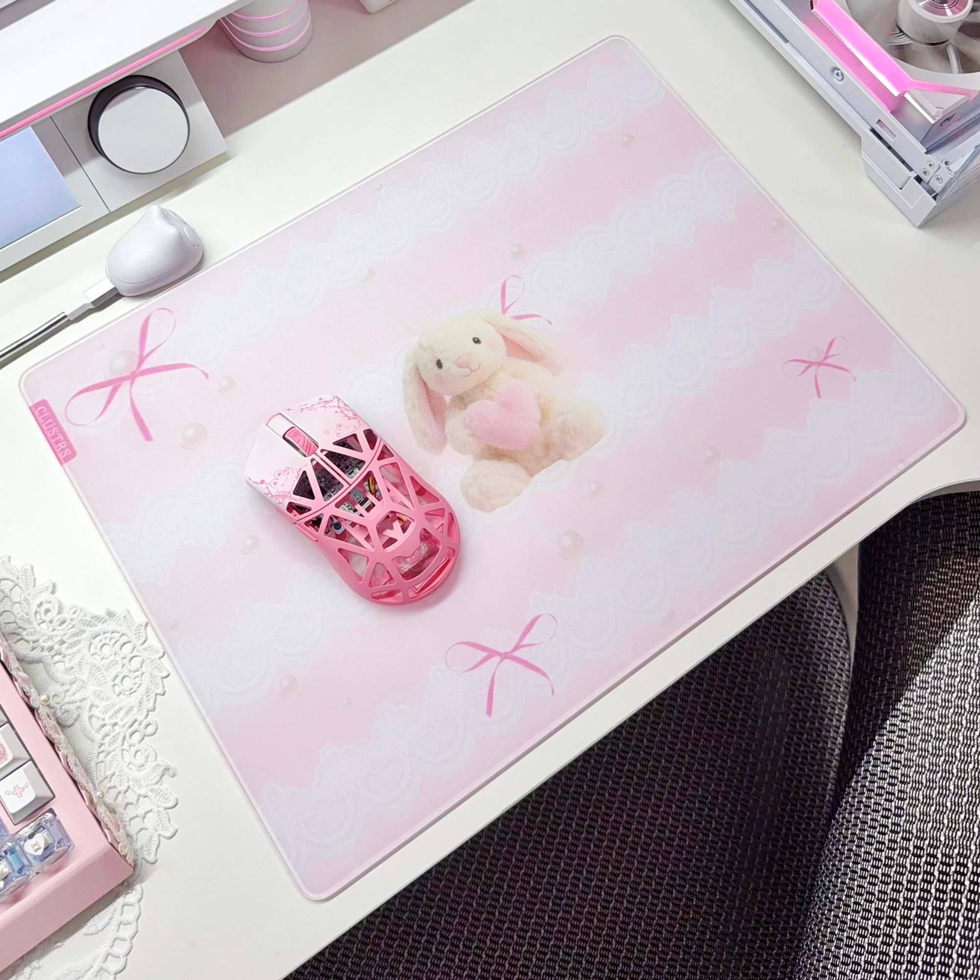 Pearl Bunny glass mousepad in a pink and white desk setup with a matching gaming mouse.
