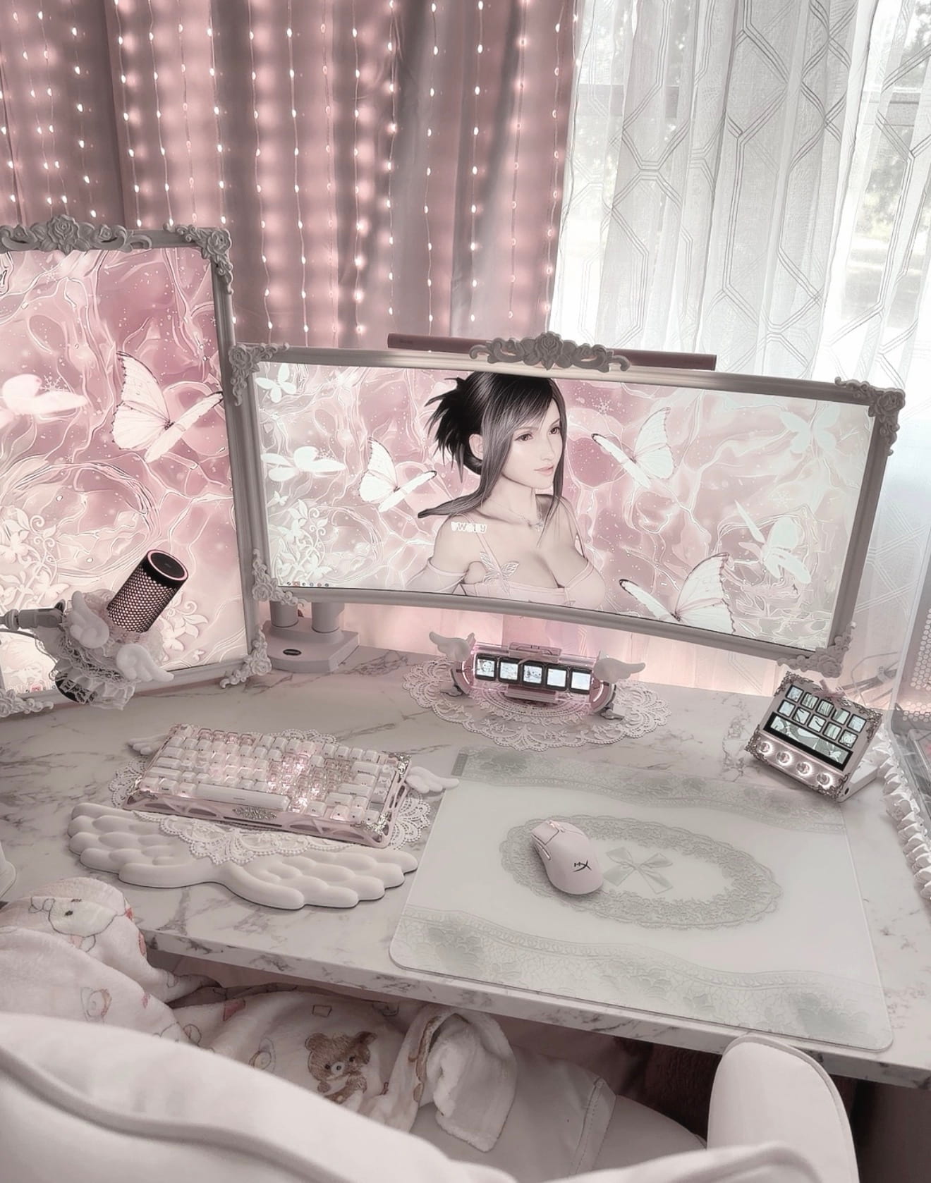 White Lacey glass mousepad in a pink cozy desk setup with fairy lights, a curved monitor, and white accessories.