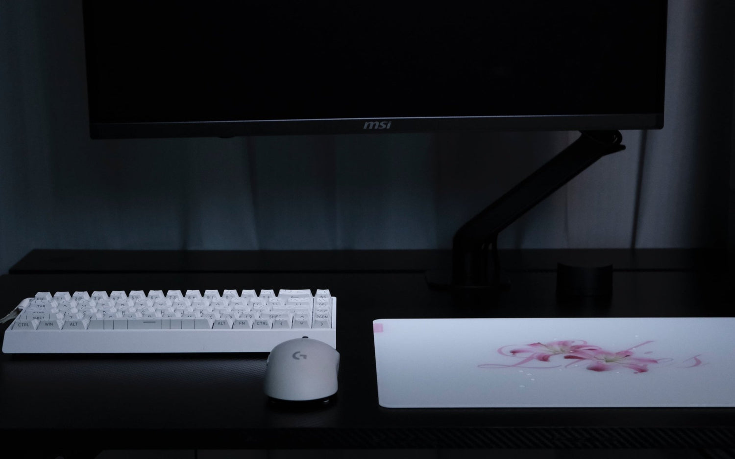 CLUSTRS Lilies glass mousepad in a study and gaming setup, combining floral calm, smooth glide, and reliable control