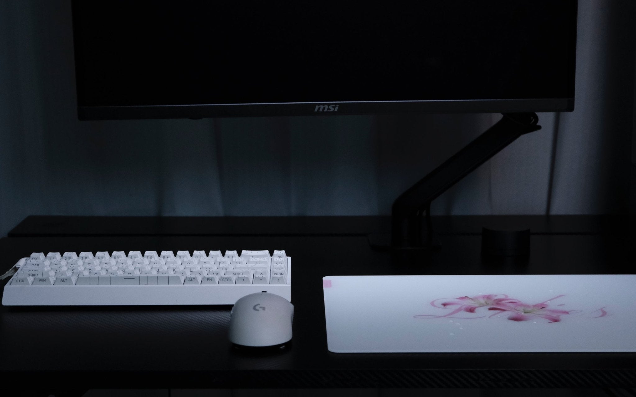 CLUSTRS Lilies glass mousepad in a study and gaming setup, combining floral calm, smooth glide, and reliable control