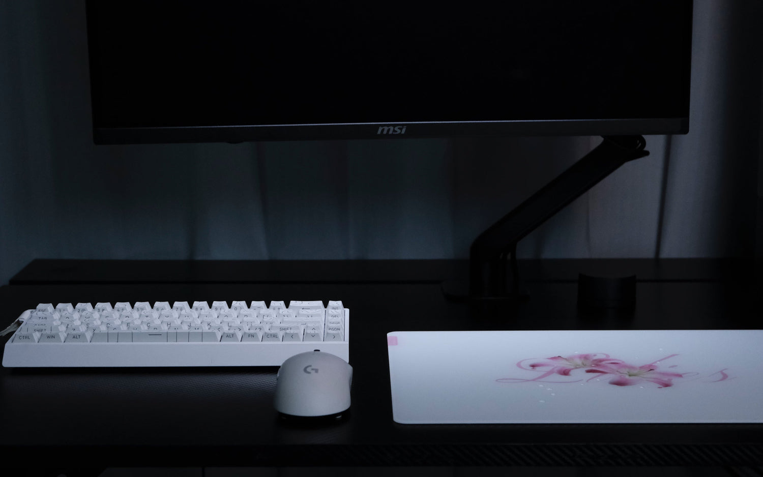 CLUSTRS Lilies glass mousepad in a study and gaming setup, combining floral calm, smooth glide, and reliable control