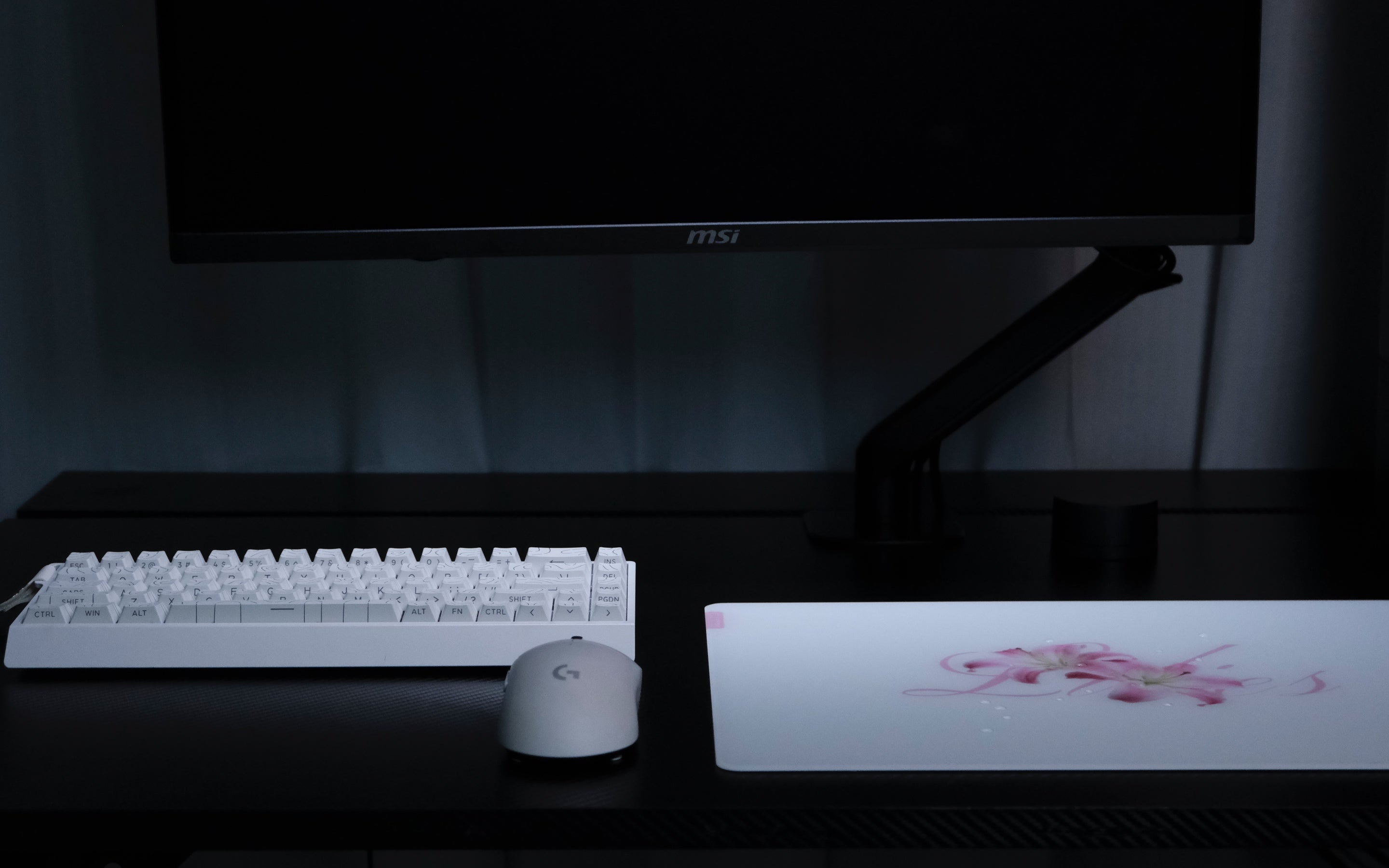 CLUSTRS Lilies glass mousepad in a study and gaming setup, combining floral calm, smooth glide, and reliable control