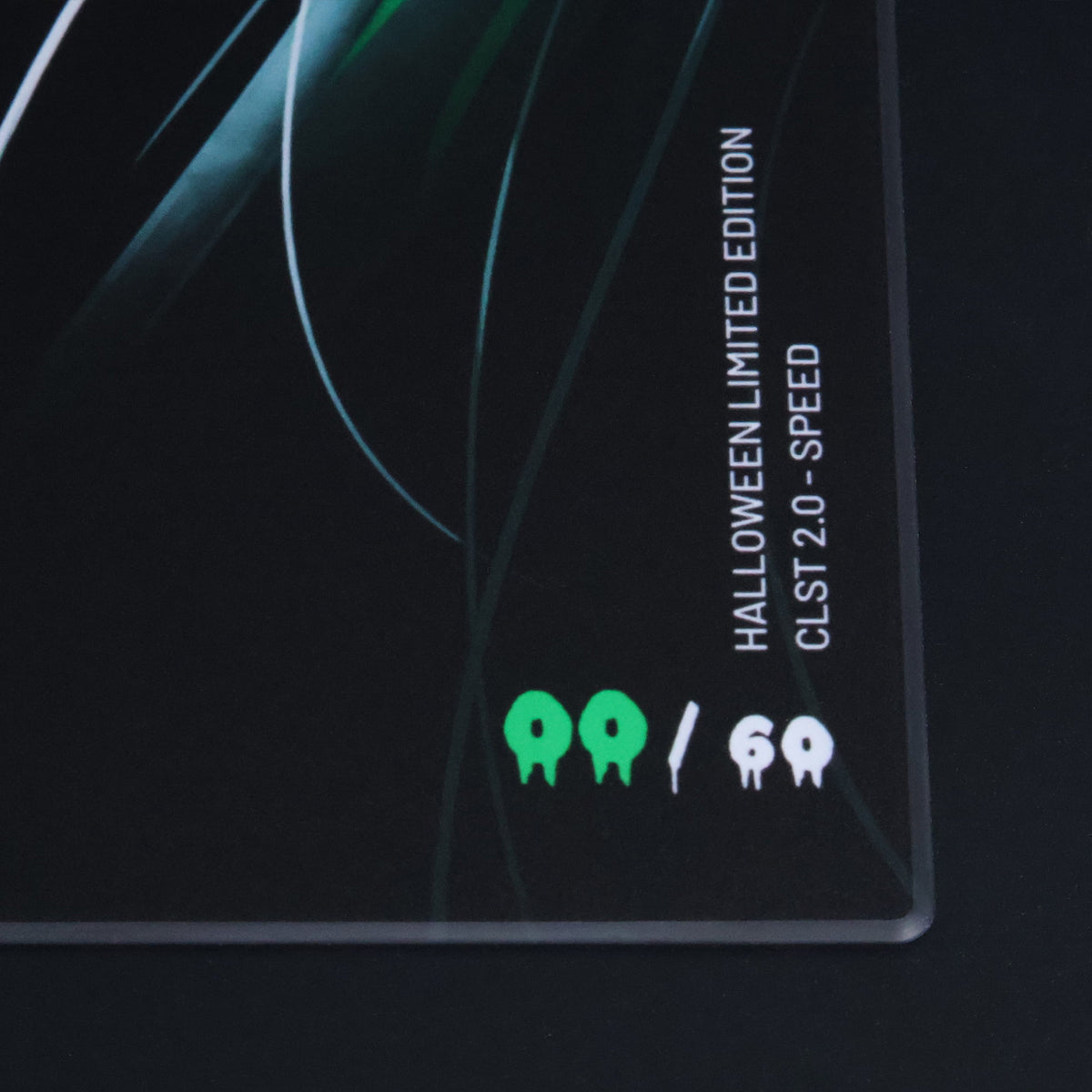 Close-up of the SPECTER edition marking on the Astra’s Gaze CLST 2.0 Speed glass mousepad, showing its Halloween limited edition design and 60-piece run.