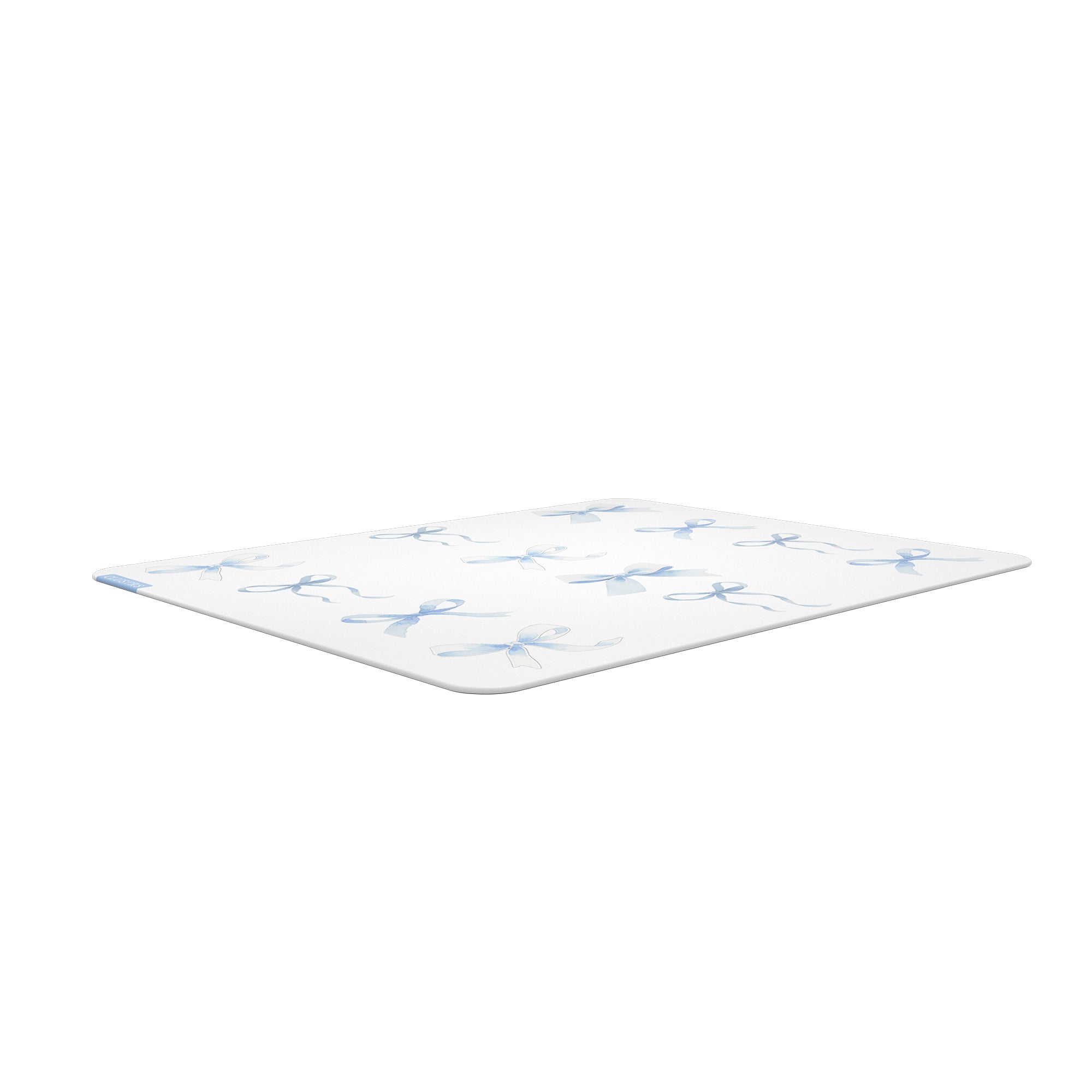Low-angle view of the Blue Whisper glass mousepad showing its slim profile, rounded edges, and soft blue bow pattern.
