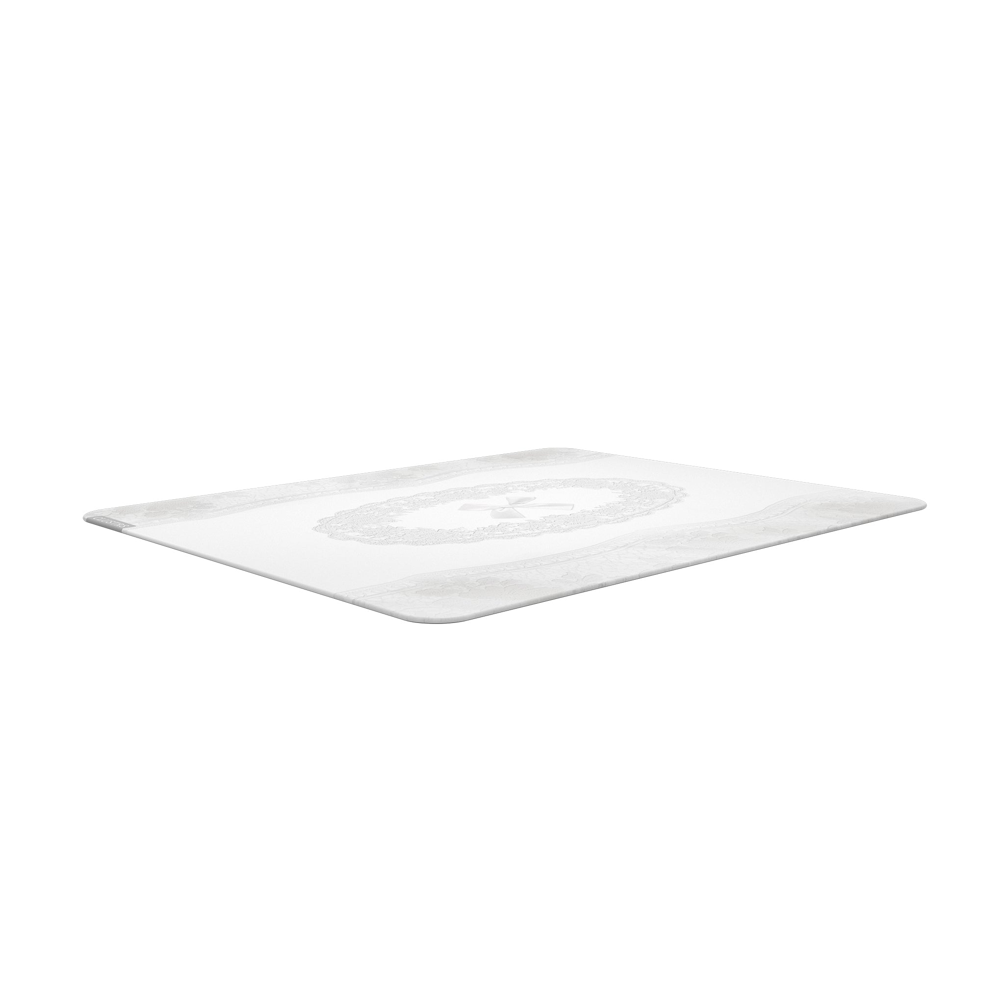 Low-angle view of the CLUSTRS White Lacey glass mousepad showing its slim profile, rounded edges, and delicate lace design.