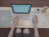 A cozy and minimalist desk setup showcasing a 260 x 210mm small glass mouse pad designed for compact workspaces.